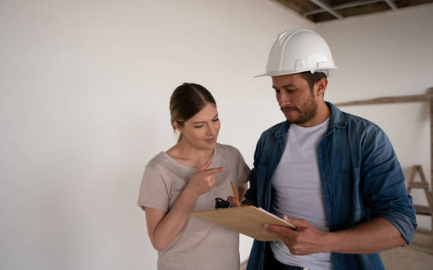 Roofing contractor discussing a project with a homeowner